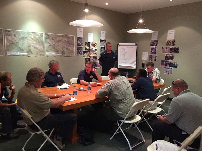 Area Command photo: Area Command staff from EPA and Coast Guard receive updates during a morning briefing Area Command photo: Area Command staff from EPA and Coast Guard receive updates during a morning briefing