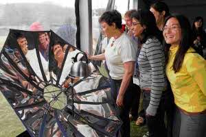 Vistors to P3 observe a display